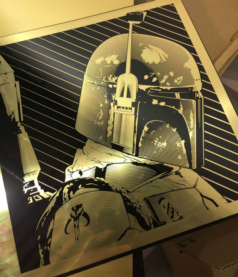 "Boba Fett" by Joshua Budich. 12" x 12" Laser engrave on brass. Ed of 20 S/N. $100